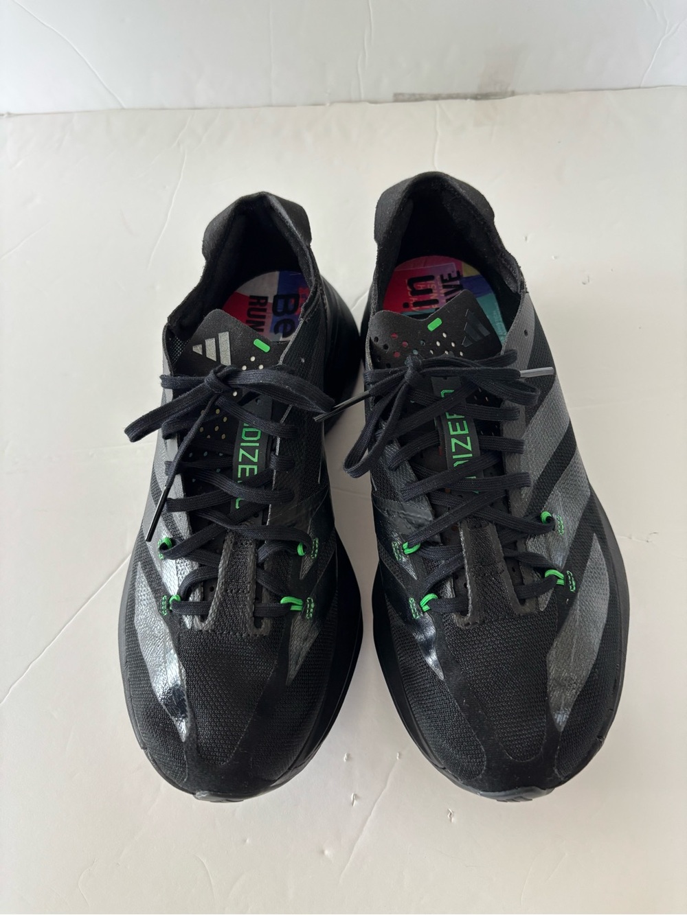 ADIZERO, BERLÍN, RUN & RAVE  ;Black Running Shoes with Green Accents UNISEX.